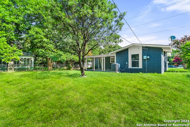 view of yard featuring central AC