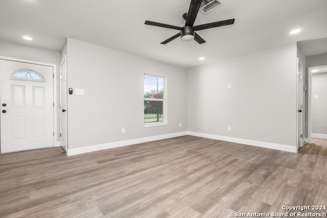 foyer with light hardwood / wood-style floors and ceiling fan