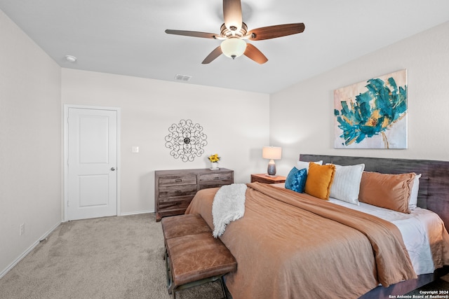 bedroom featuring ceiling fan and light carpet