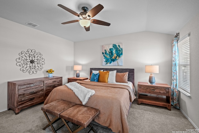 bedroom featuring vaulted ceiling, ceiling fan, and light colored carpet