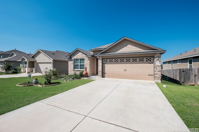 ranch-style home with a garage and a front yard