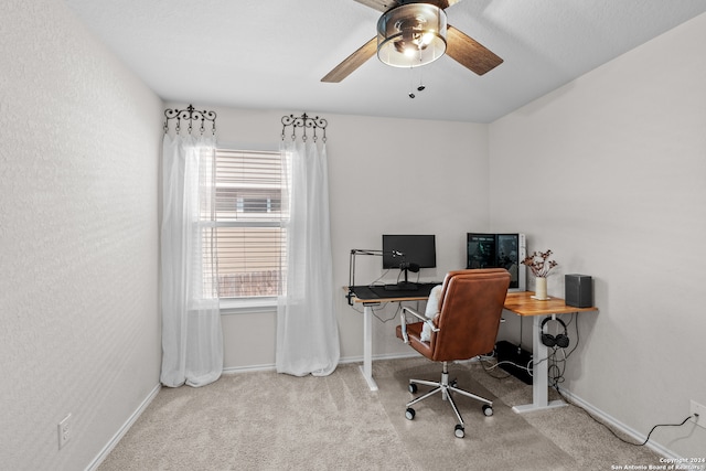 carpeted office with ceiling fan