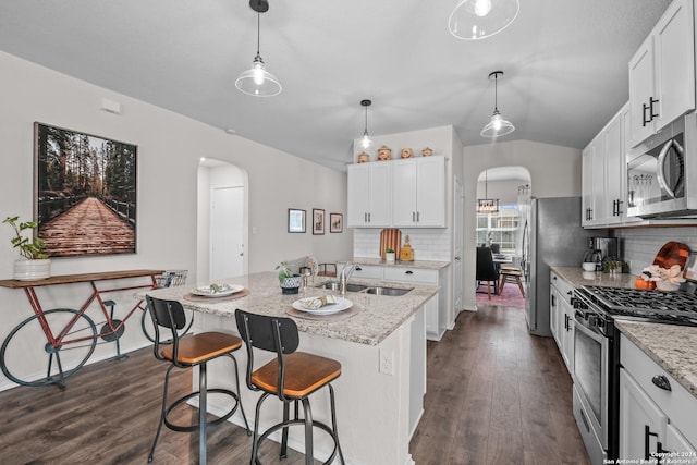 29710 Spring Copper, Bulverde, TX 78163 - kitchen with a sink, appliances with stainless steel finishes, tasteful backsplash, and arched walkways