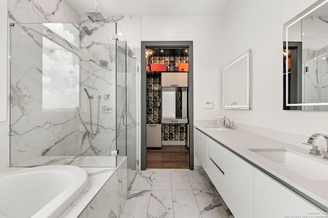 bathroom featuring plus walk in shower and vanity