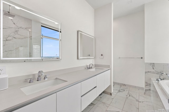 bathroom featuring vanity and separate shower and tub