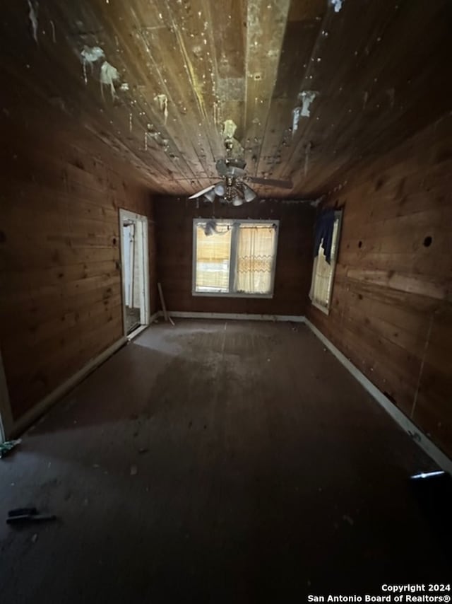 335 Elmhurst Ave, San Antonio, TX 78209 - spare room featuring wood ceiling and wooden walls