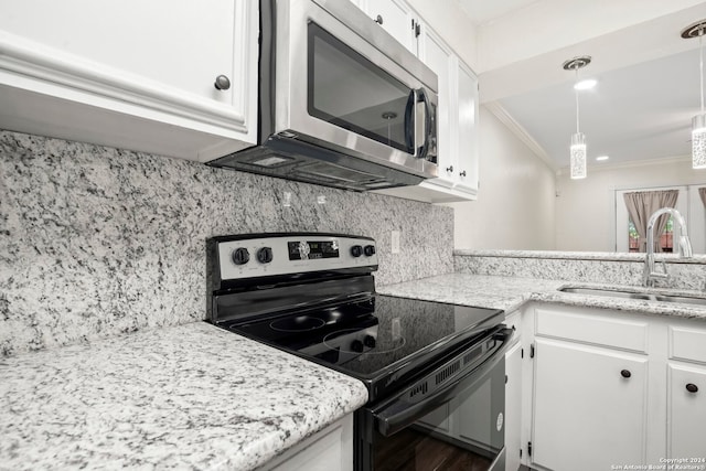 kitchen featuring hanging light fixtures, white cabinets, backsplash, black electric range oven, and sink