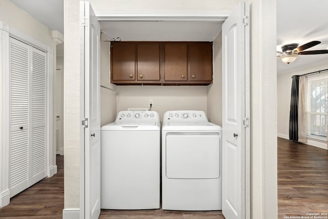 washroom with ceiling fan, washer and clothes dryer, cabinets, and dark wood-type flooring