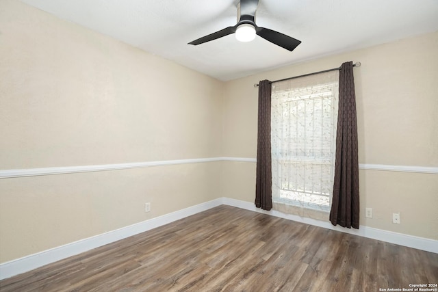 spare room featuring ceiling fan and hardwood / wood-style floors