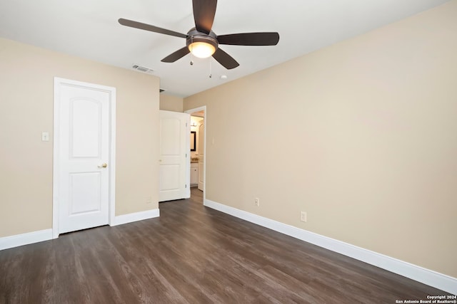 unfurnished bedroom featuring dark hardwood / wood-style flooring and ceiling fan