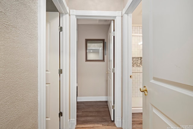 hallway featuring wood-type flooring