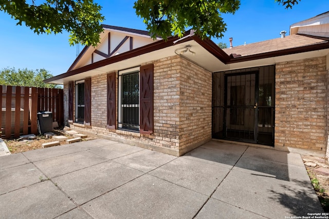 doorway to property with a patio area