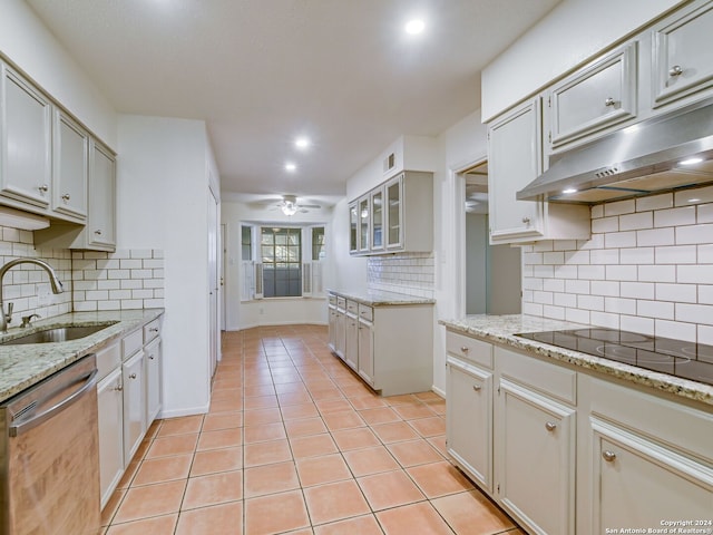 kitchen with ceiling fan, sink, stainless steel dishwasher, decorative backsplash, and light tile patterned floors