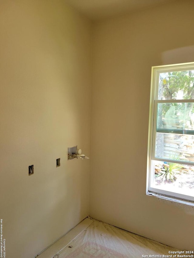 clothes washing area featuring washer hookup