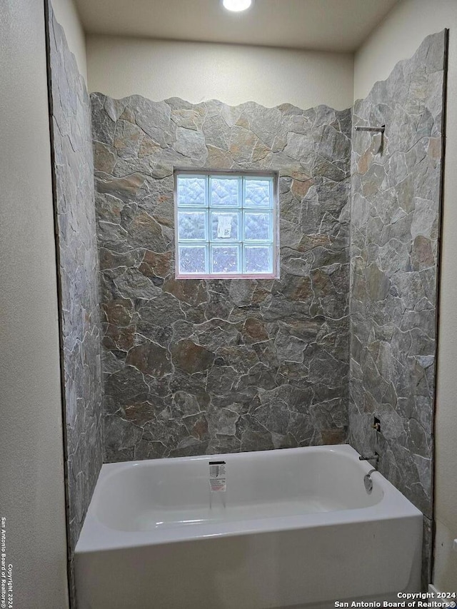 bathroom featuring a washtub