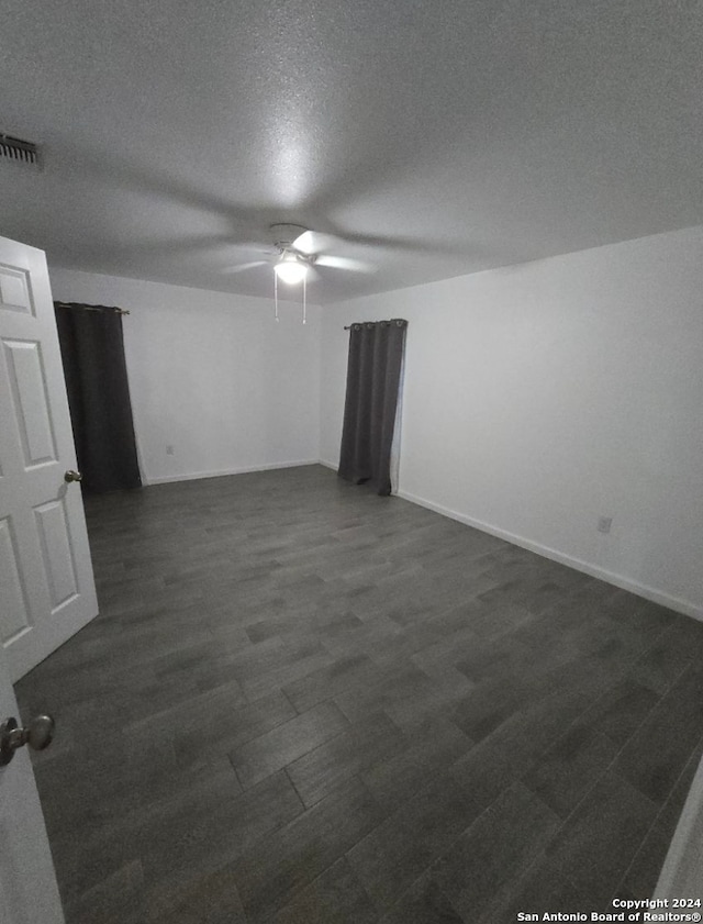 spare room with ceiling fan and a textured ceiling