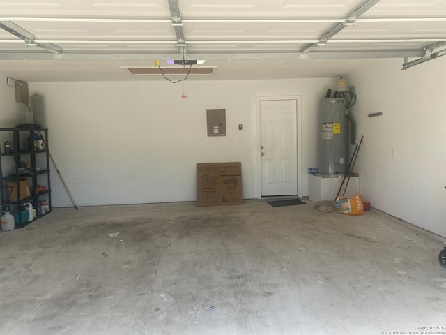 garage featuring electric panel and electric water heater