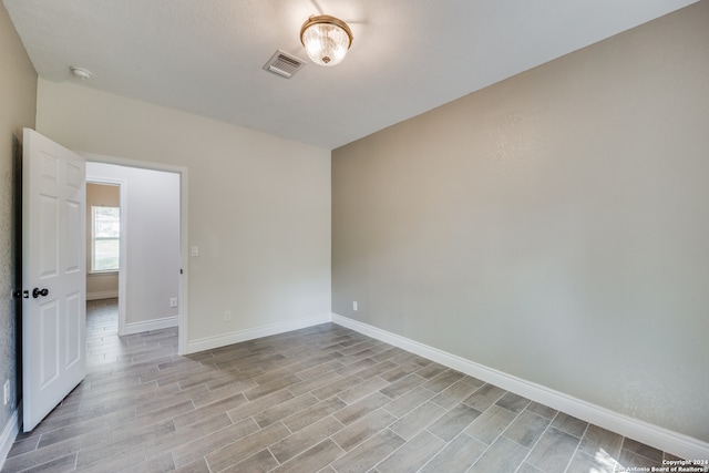 empty room with light wood-type flooring