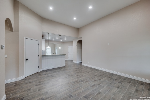 unfurnished living room featuring wood-type flooring