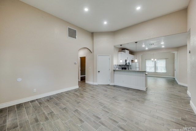 unfurnished living room with light hardwood / wood-style floors