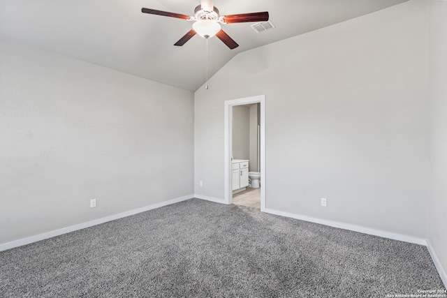 empty room with ceiling fan, lofted ceiling, and light carpet