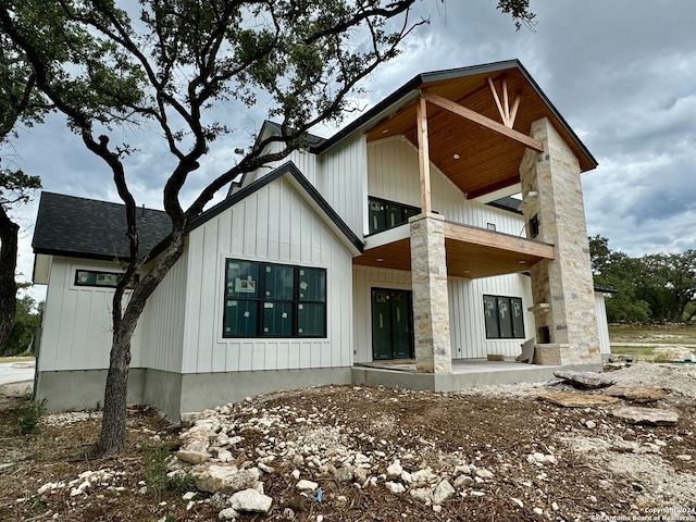 back of property with a balcony