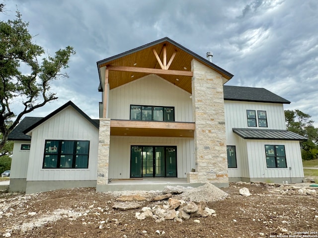 back of property featuring a patio area