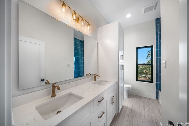 full bathroom featuring vanity, toilet, and shower / tub combination