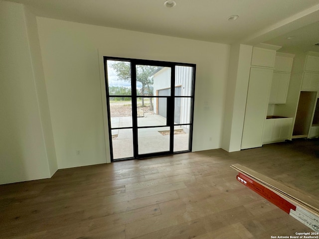 empty room with light hardwood / wood-style floors