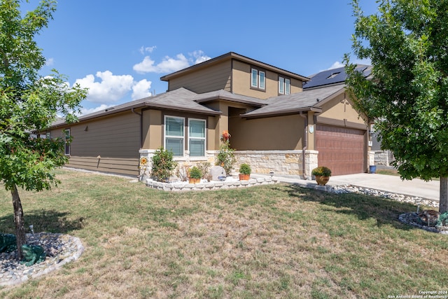 view of front facade featuring a garage and a front lawn