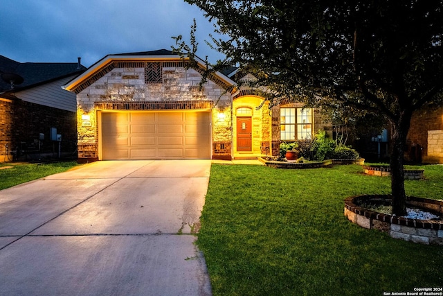 view of front of house with a garage and a front yard