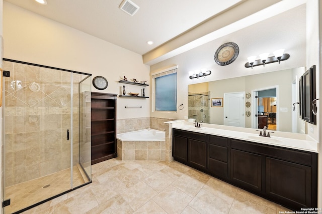 bathroom with shower with separate bathtub, vanity, and tile patterned floors