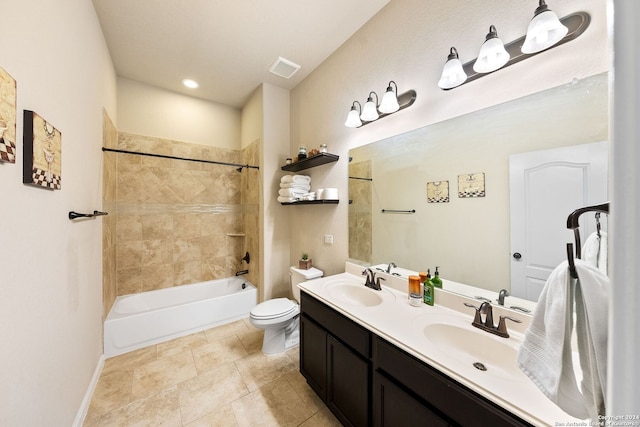 full bathroom featuring vanity, toilet, and tiled shower / bath