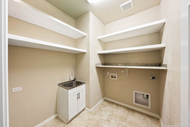 clothes washing area featuring electric dryer hookup, sink, hookup for a washing machine, and gas dryer hookup