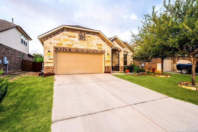 view of front of property featuring a garage and a front yard