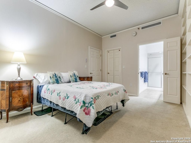 1 Towers Park Ln Unit 503, San Antonio, TX 78209 - bedroom featuring light carpet, baseboards, ornamental molding, a ceiling fan, and a closet