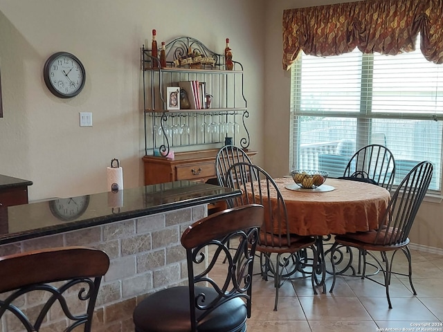 dining area with light tile patterned floors