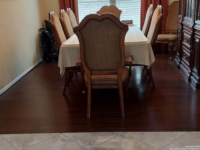 dining room featuring plenty of natural light and light tile patterned floors