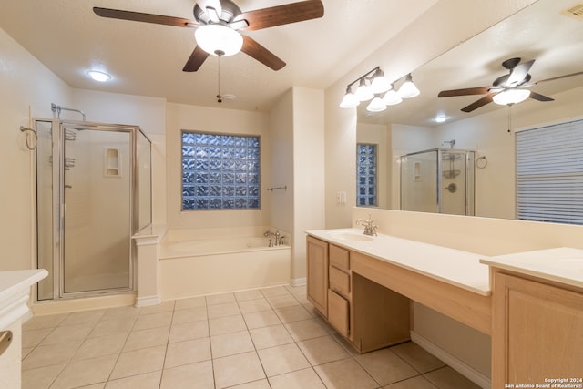 bathroom featuring shower with separate bathtub, vanity, ceiling fan, and tile patterned floors