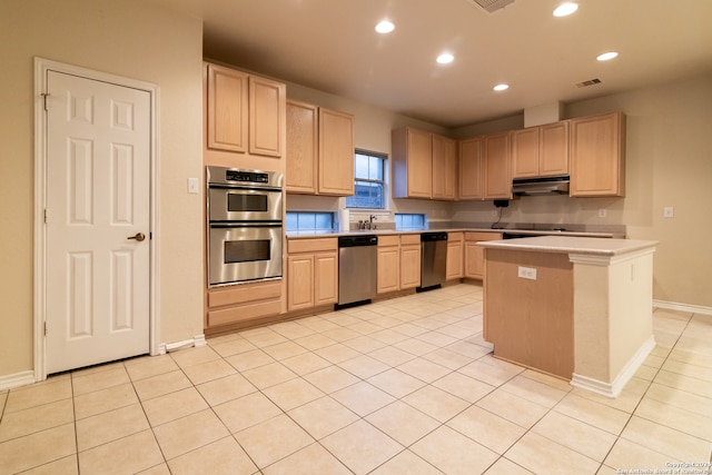 kitchen featuring stainless steel appliances, light brown cabinets, and light tile patterned floors