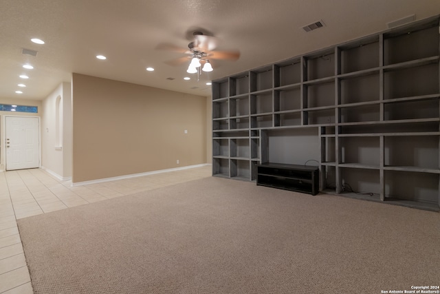 interior space featuring ceiling fan and light tile patterned flooring