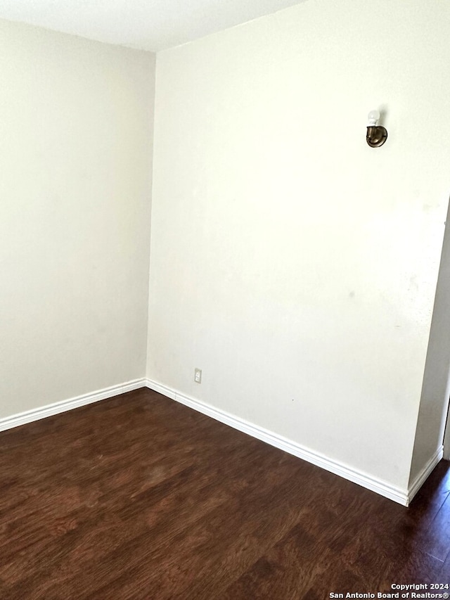 empty room featuring dark hardwood / wood-style floors