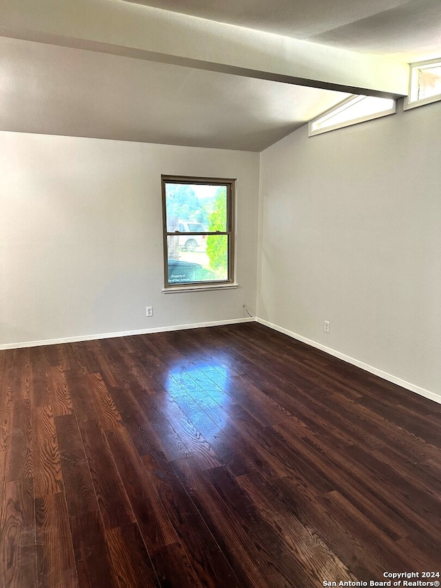 empty room featuring dark wood-type flooring