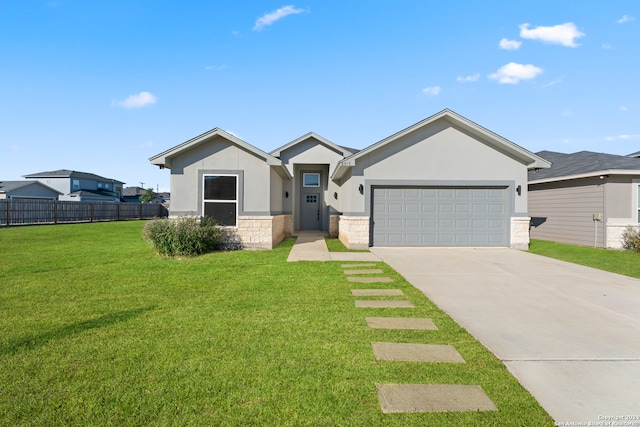 view of front of home featuring fence, a front lawn, stone siding, a garage, and concrete driveway
