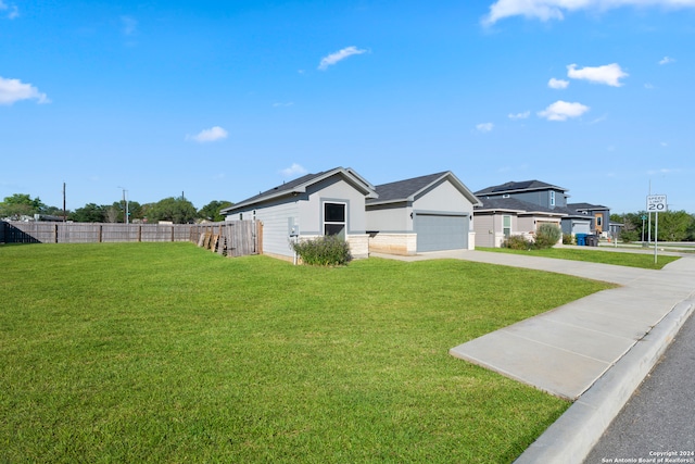 exterior space with a garage and a yard