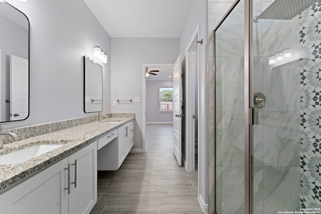 bathroom with walk in shower, vanity, ceiling fan, and hardwood / wood-style flooring