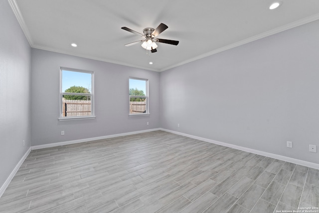 empty room featuring ceiling fan, light hardwood / wood-style flooring, and ornamental molding