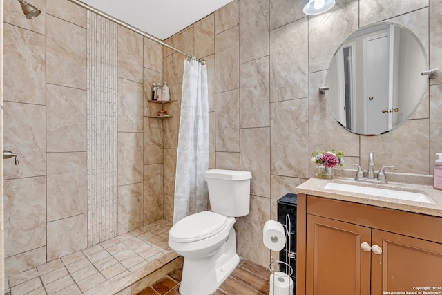 bathroom featuring a shower with shower curtain, tile walls, vanity, and toilet