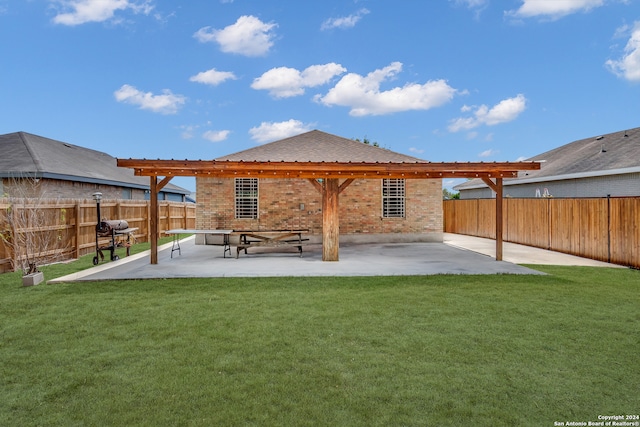 rear view of property with a patio and a lawn