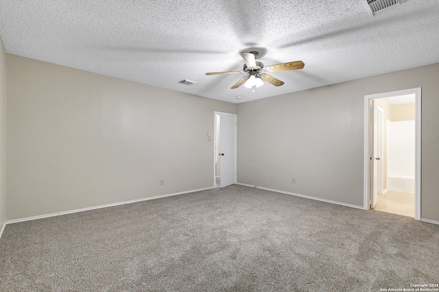 unfurnished room with ceiling fan, a textured ceiling, and carpet floors